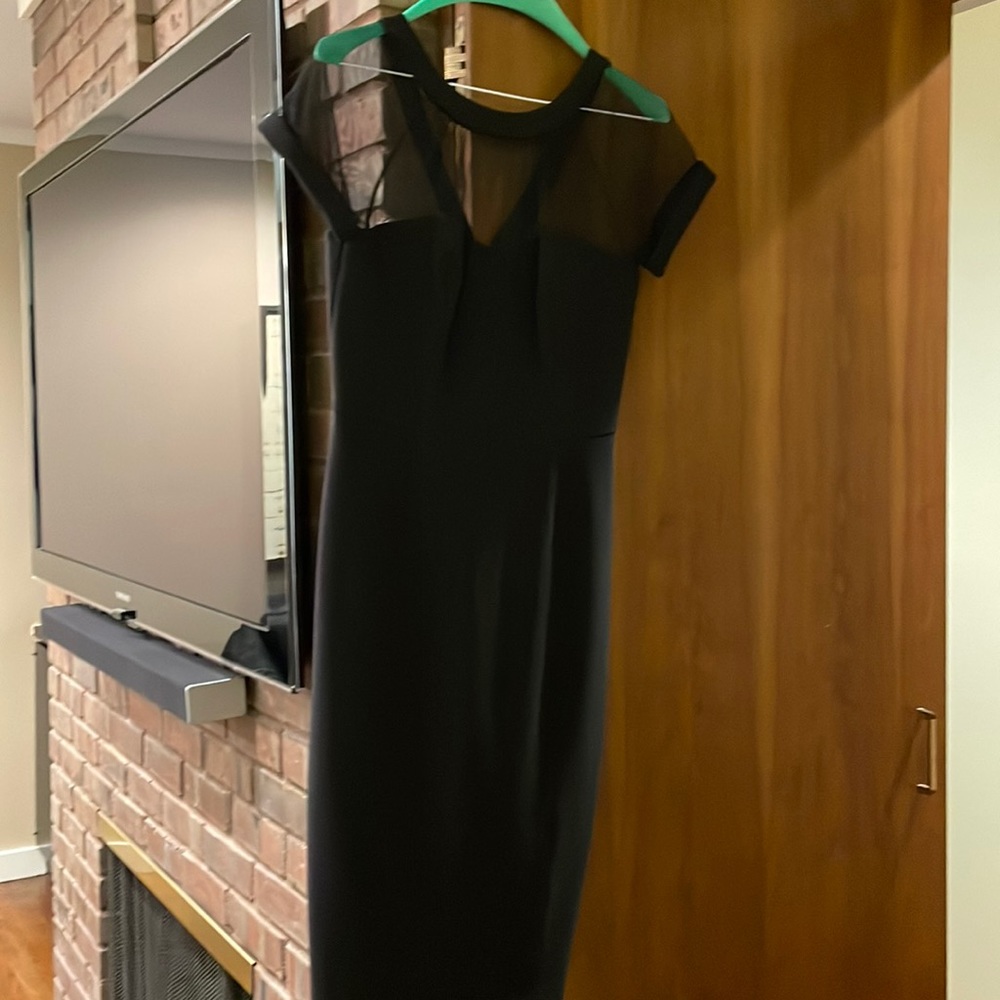 Black cocktail dress with sheer sleeves